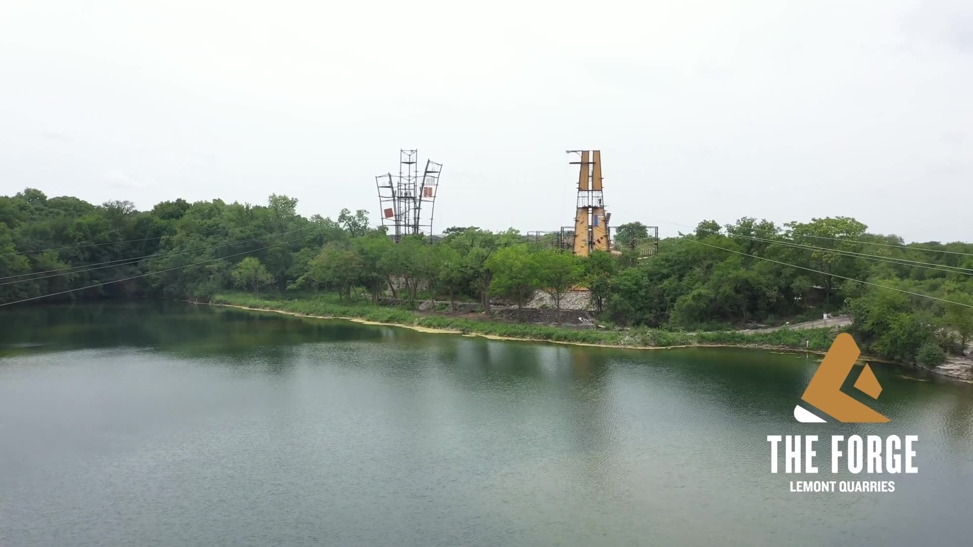 Bonsai steel towers at The Forge, Lemont Quarries, seen across the quarry lake